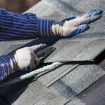 diy roofing a home by cutting shingle