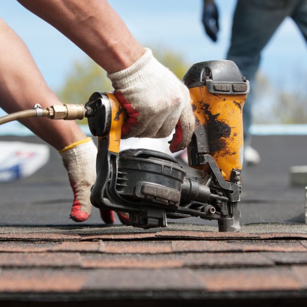 roofer drilling roof