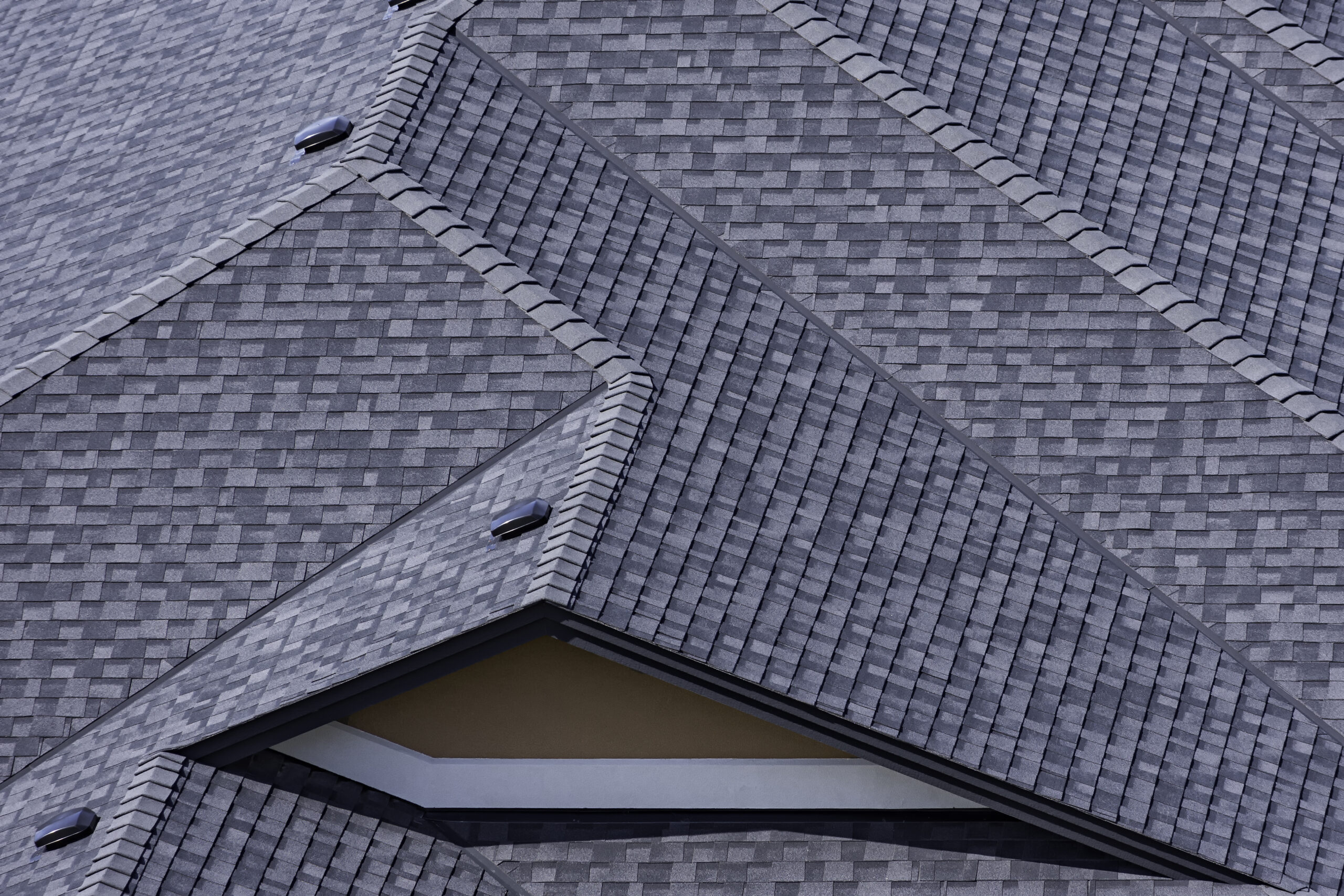 rooftop in a newly constructed subdivision in kelowna british columbia canada showing asphalt shingles